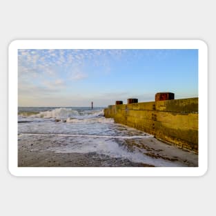 Wooden groynes on the sandy beach on the Norfolk coast Sticker